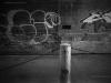 A post, a chain, some graffiti